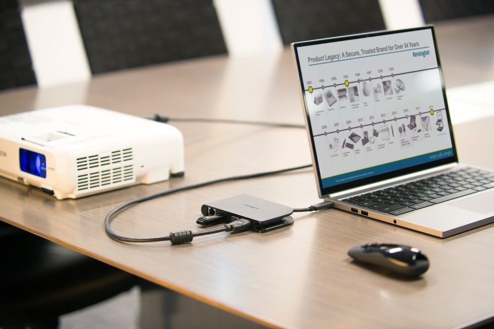 A laptop set up for a presentation and connected to a projector