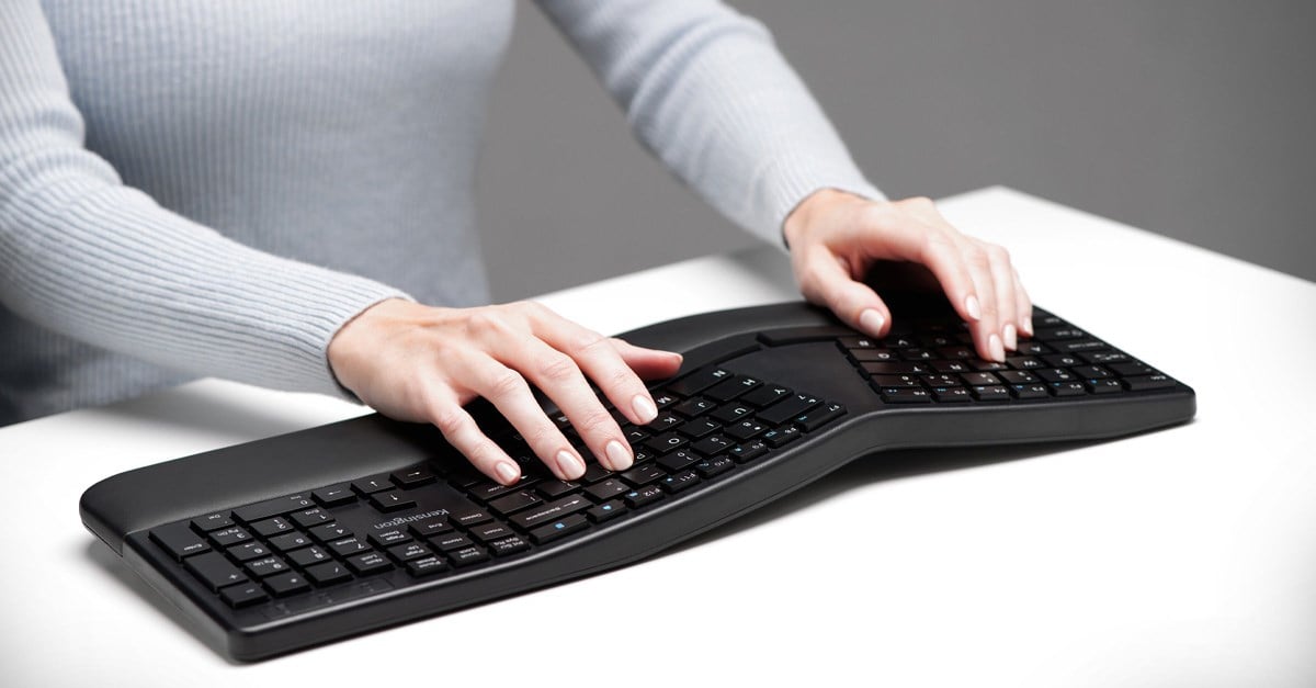 Person typing on a keyboard