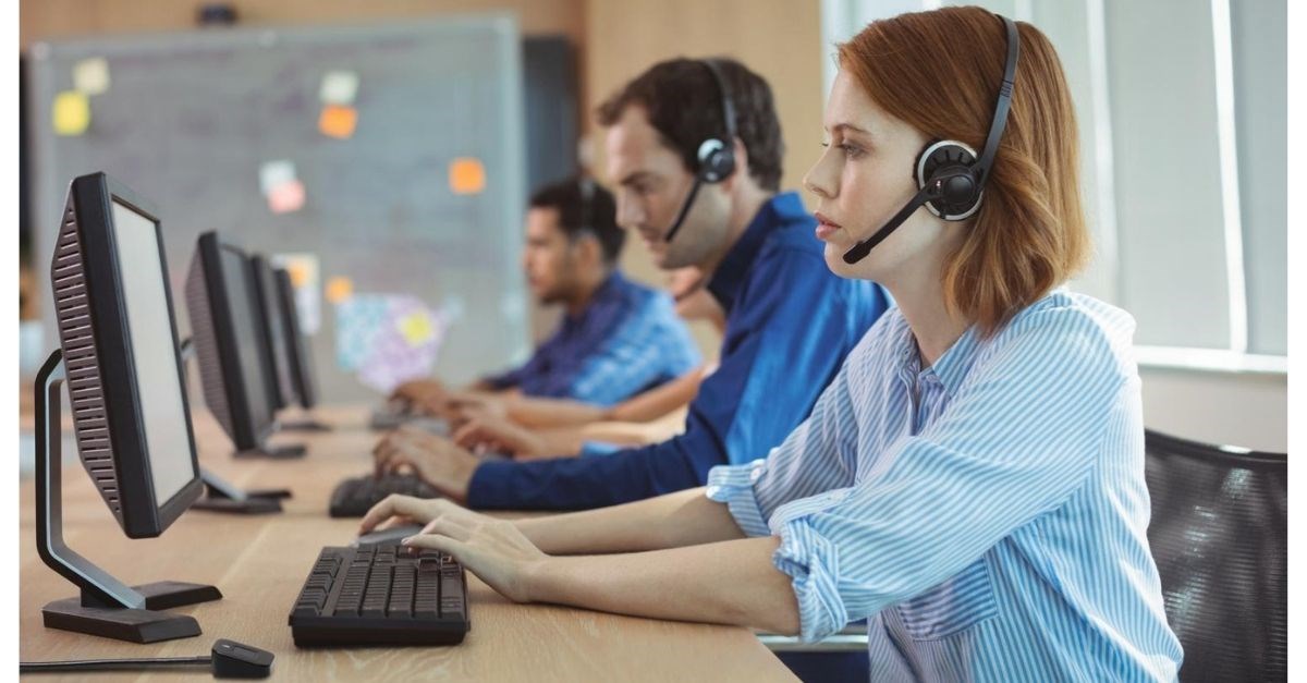 Office staff working on computers with Kensington VeriMark biometric access.jpg