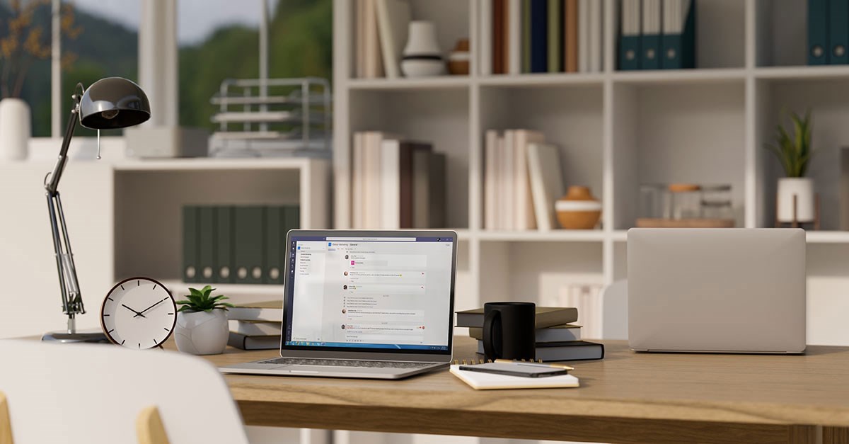 Laptop on a wooden desk.