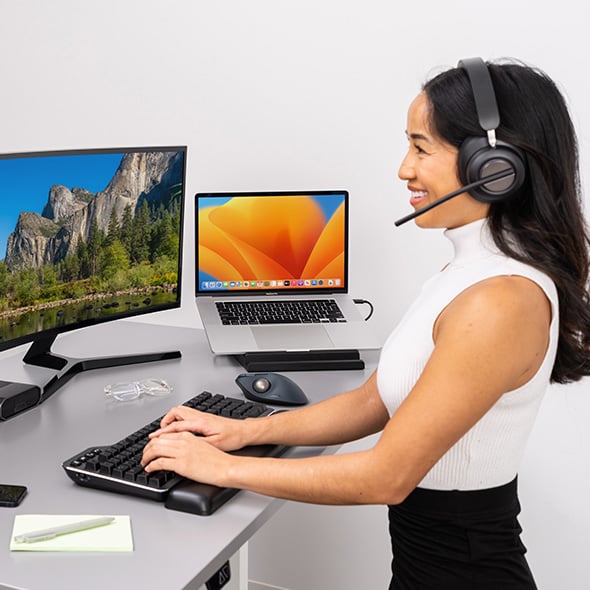 Woman having a video conference wearing her H3000 headsets.