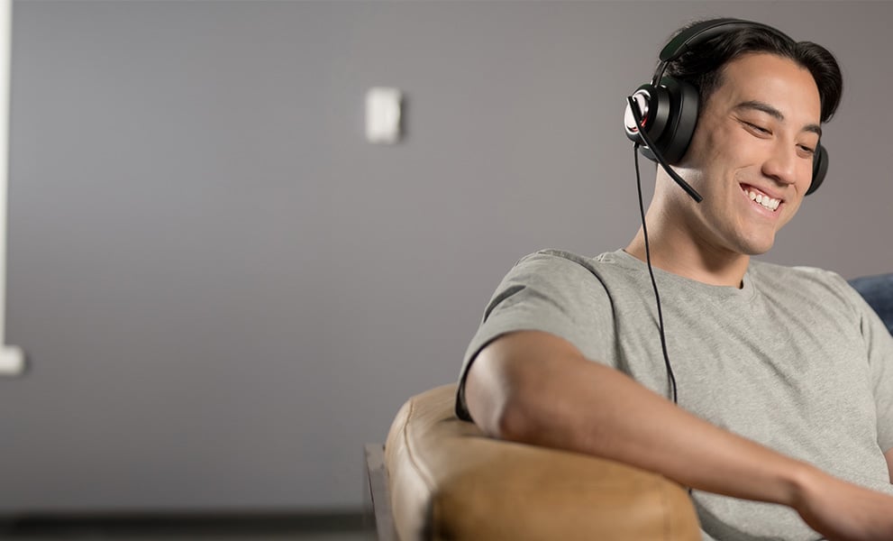 Man having a video conference wearing his H2000 headsets.