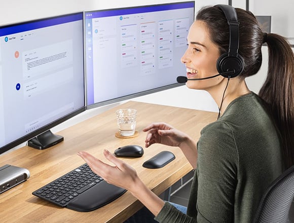 Woman working from home using Kensington products.