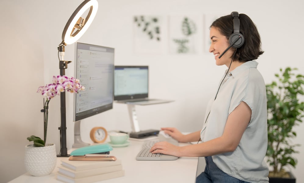 Woman with a Kensington headset responding to a customer