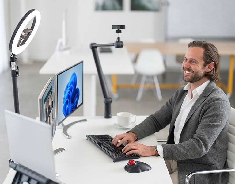 Man using Kensington products at desk