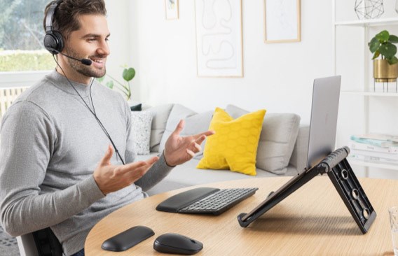 Man using headset in home office on white background