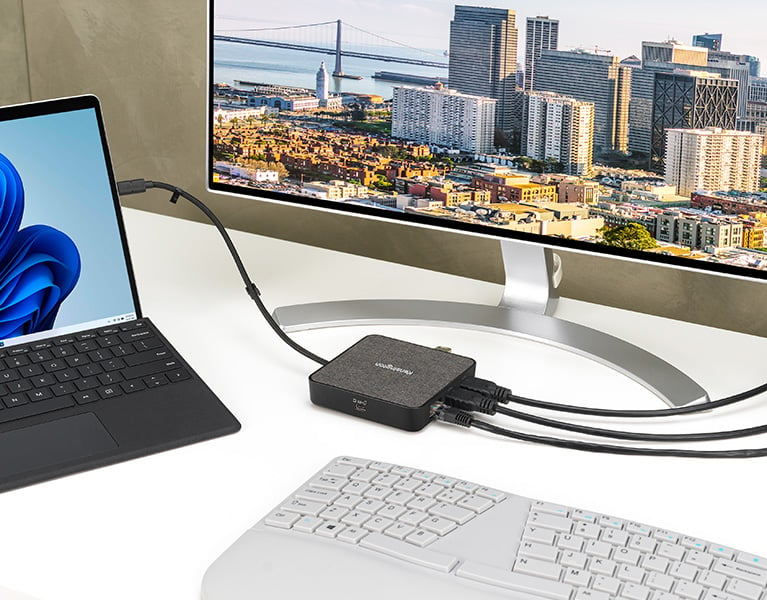 Laptop connected to several devices thanks to a kensington dock designed for microsoft surface.