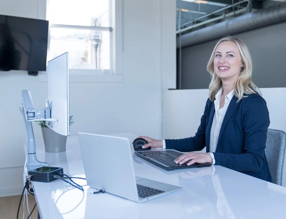 Woman in an office with Kensington products